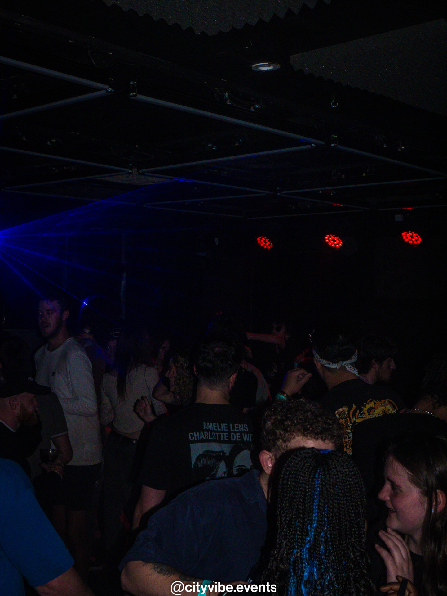 DJ at the booth in Bluebox York, lit by deep blue light